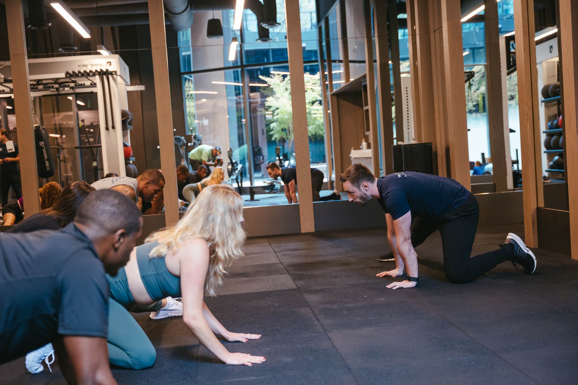 Employees participating in a group stretch session led by WorkLife Wellness